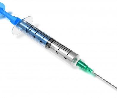 Medical syringe isolated on white