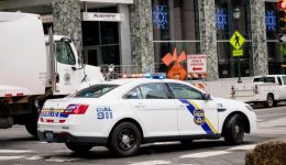 Philadelphia, USA. June 23, 2018. Police car with lights waiting for traffic lights